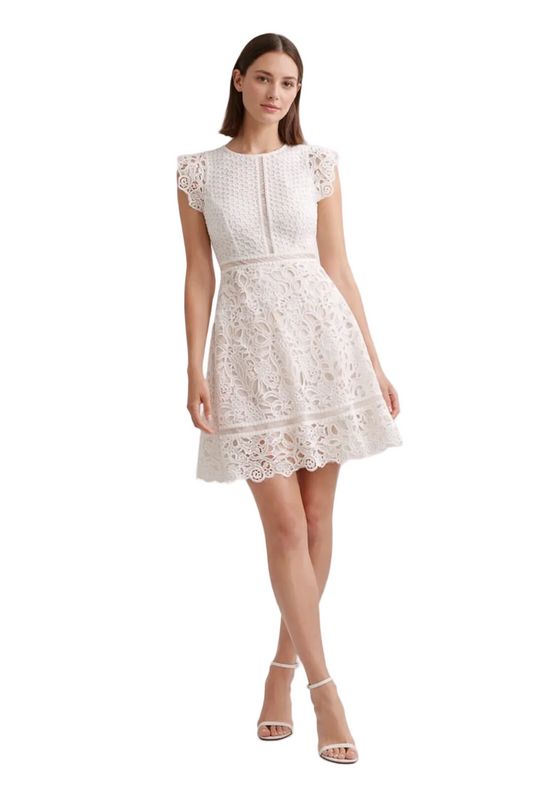 White lace mini dress with cap sleeves and cut-out pattern