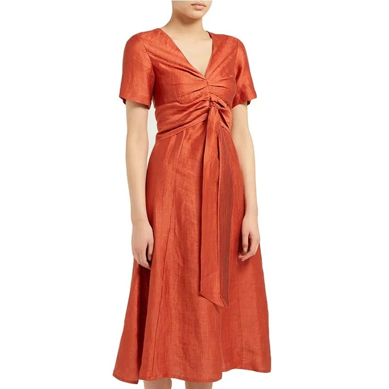Rust orange midi dress with V-neck and waist tie detail