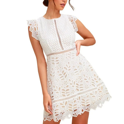 White lace mini dress with cap sleeves and cut-out pattern