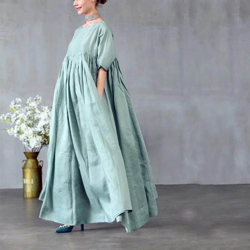 Light green maxi dress with gathered bodice and loose fit