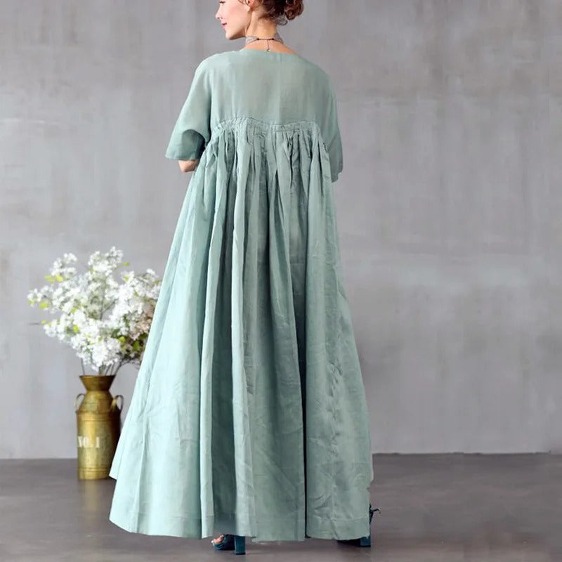 Light green maxi dress with gathered bodice and loose fit