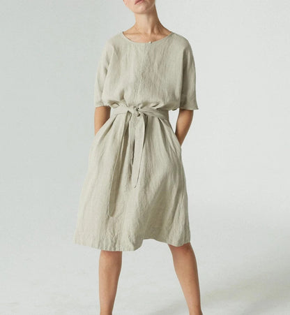 Light green knee-length dress with round neck and tie waist