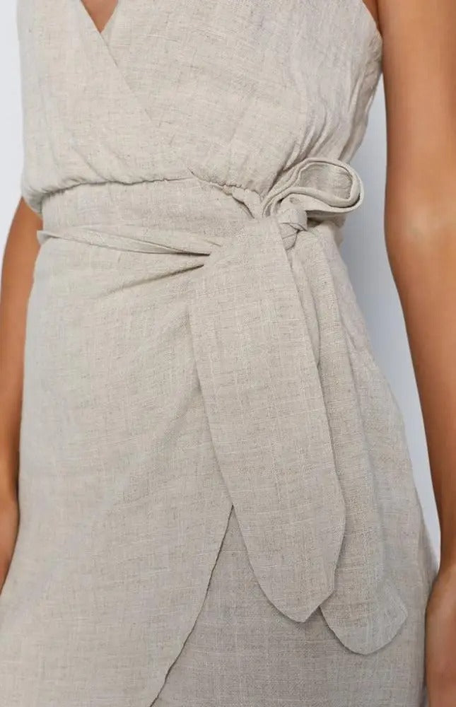 Beige wrap mini dress with deep V-neck and side tie